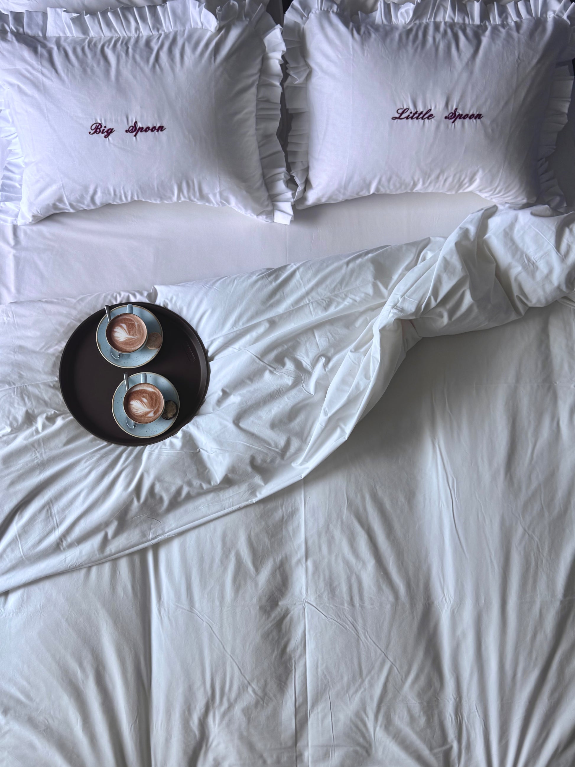 Lifestyle picture of "Big Spoon" and "Little Spoon" pillowcases