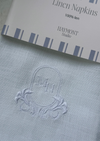 White linen napkin with crest and initials - zoomed in