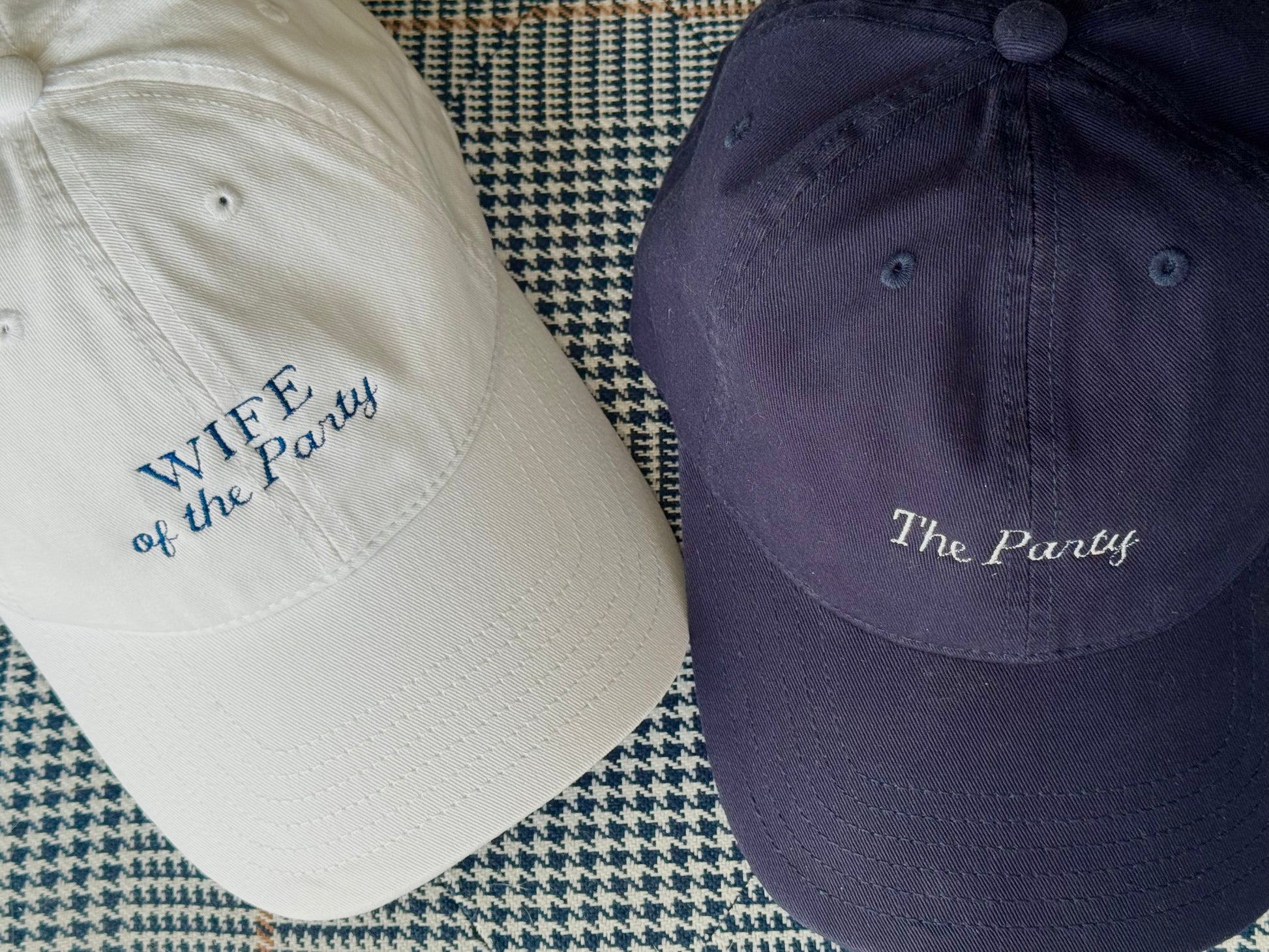 White hat "Wife of the Party" and navy hat "The Party"