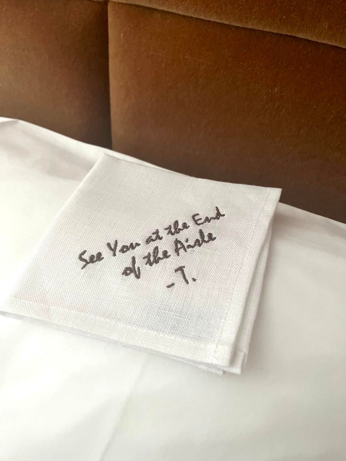 Example of linen napkin with your personalised writing "See you at the end of aisle -T."