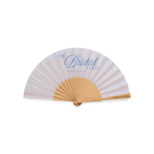 White fan with blue writing "The bridal club"