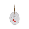 A key ring with the initials “AK” and a chili pepper icon